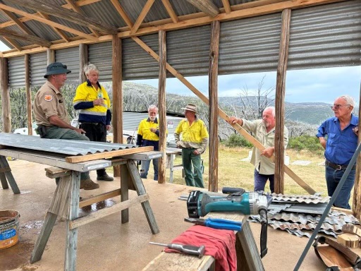 Builders work on hut rebuild