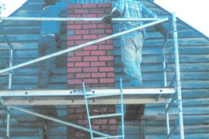 Jack Palmer and Lyn Craven fit temporary corrugated iron. May 1999