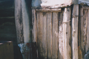 Wheelers chimney, west side before, rotting bottom log and posts. Unknown, 2004. 